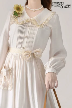 Cream elegant lolita long-sleeve midi dress set with v-neck collar and lace details front view upper body torso model sunflower brooch pearl necklace