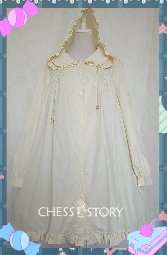 Cream beige yellow Lolita raincoat full front view with Peter Pan collar ruffled trim attached hood and button closure on dress form