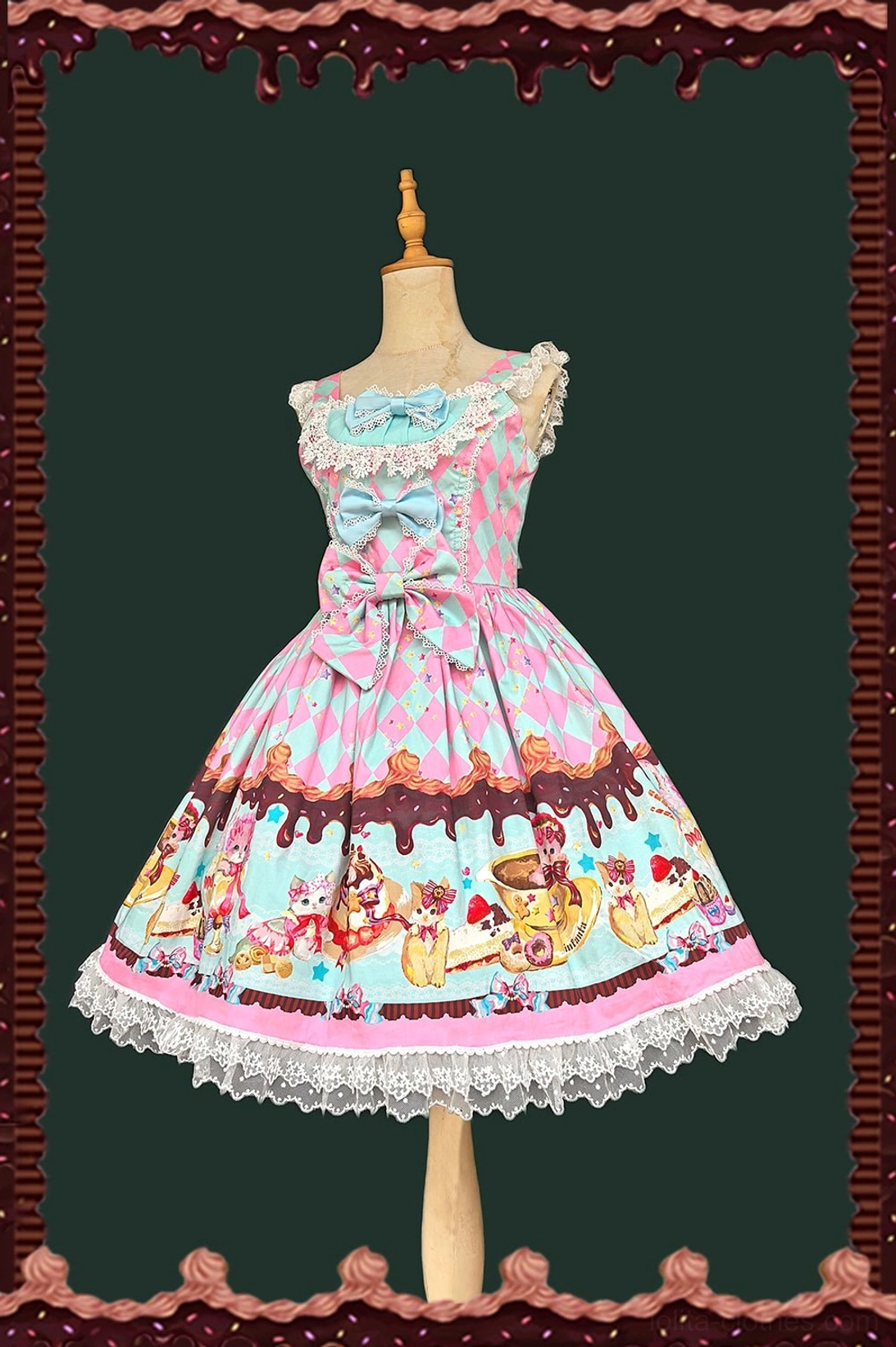 Mint blue sweet lolita jumper skirt front view with light blue bow, lace-trimmed neckline, mint bodice, and classic cartoon cat dessert hem prints