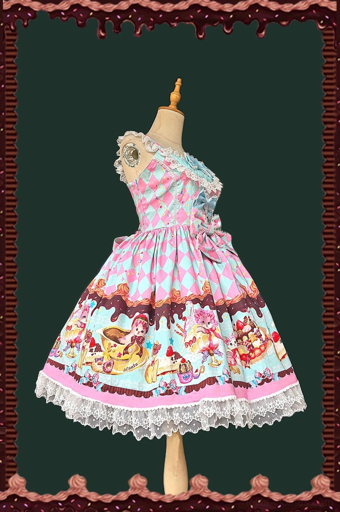 Pink and mint blue sweet lolita jumper skirt side view showing one-shoulder lace strap, argyle pattern bodice, ruffled lace hem, and matching prints