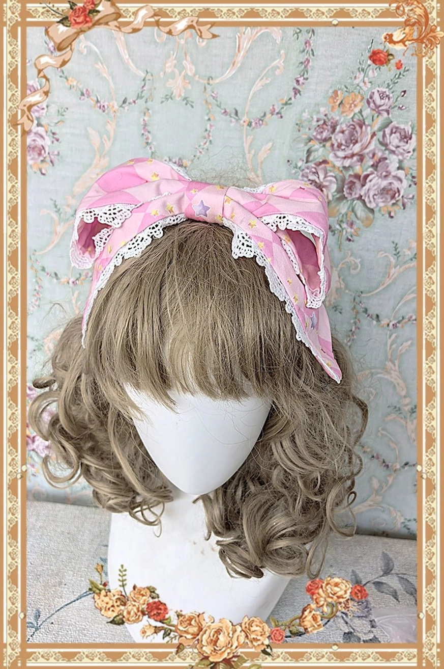 Cream meow sweet lolita jumper skirt paw print bow ending detail showing decorative bow design with paw-shaped finishing on front or back
