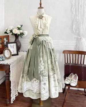 Full cream and sage green lolita two-piece outfit set with ruffled blouse and botanical cat-print skirt displayed on mannequin in vintage-inspired interior setting