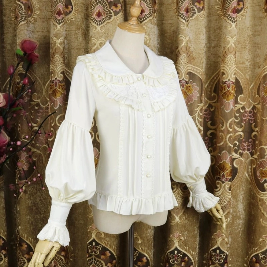 Cream white classic Lolita Peter Pan collar blouse close-up front view showing detailed front pleats, ruffled collar and hem details