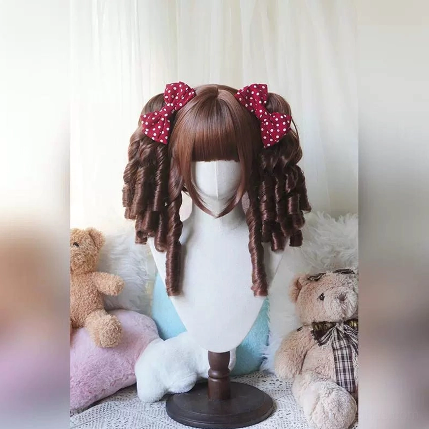 Cream white Lolita bob wig with detachable spiral ringlets and hairnet shown on mannequin head display with warm plush background
