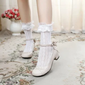 Cream white sweet lolita Mary Jane round toe leather flat shoes with tan ankle buckle strap and decorative rear bow, styled with matching ruffled lace ankle socks on vintage carpet
