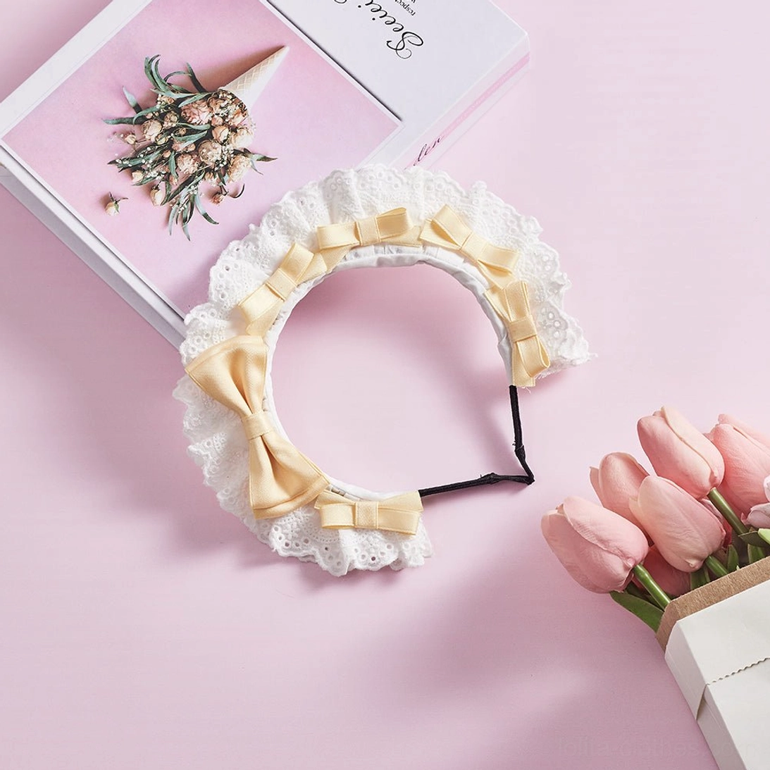 Cream yellow lolita lace KC headband flat lay display featuring dual satin bows and soft white ruffled lace edge perfect for sweet lolita coordinates