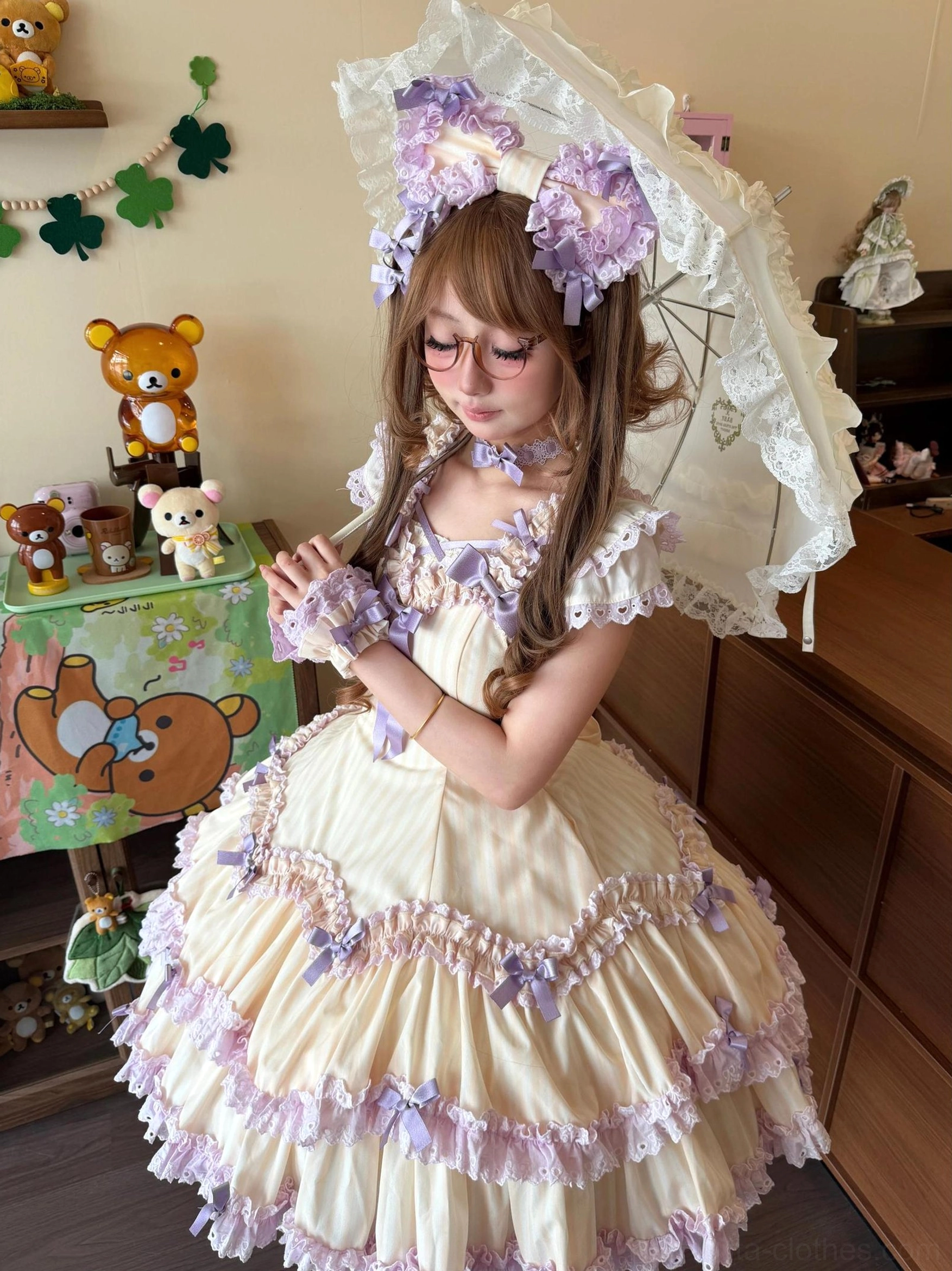 Cream yellow and purple striped Lolita JSK half-body indoor close-up showing ruffled arm cuffs, bust bow accents, matching parasol and purple flower hair accessories
