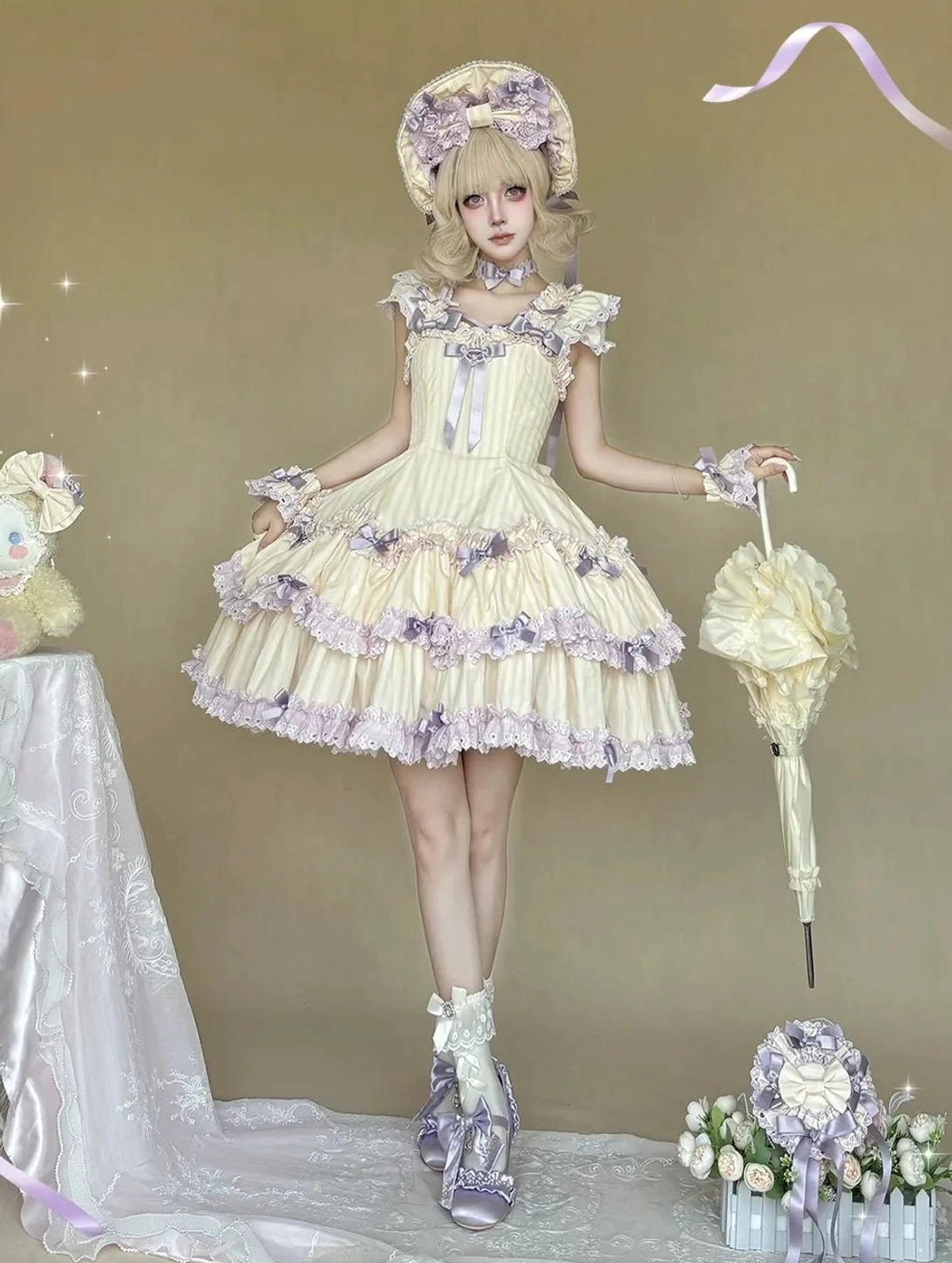 Cream yellow and purple striped Lolita jumper skirt full-body studio display with matching bonnet, ruffled sleeve trims, purple heeled shoes and parasol