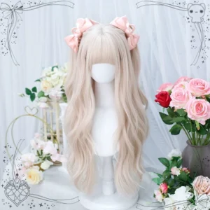 Creamy pink long curly lolita wig with air bangs styled on display mannequin, front three-quarter view, paired with pink satin bows against romantic floral backdrop with decorative frame