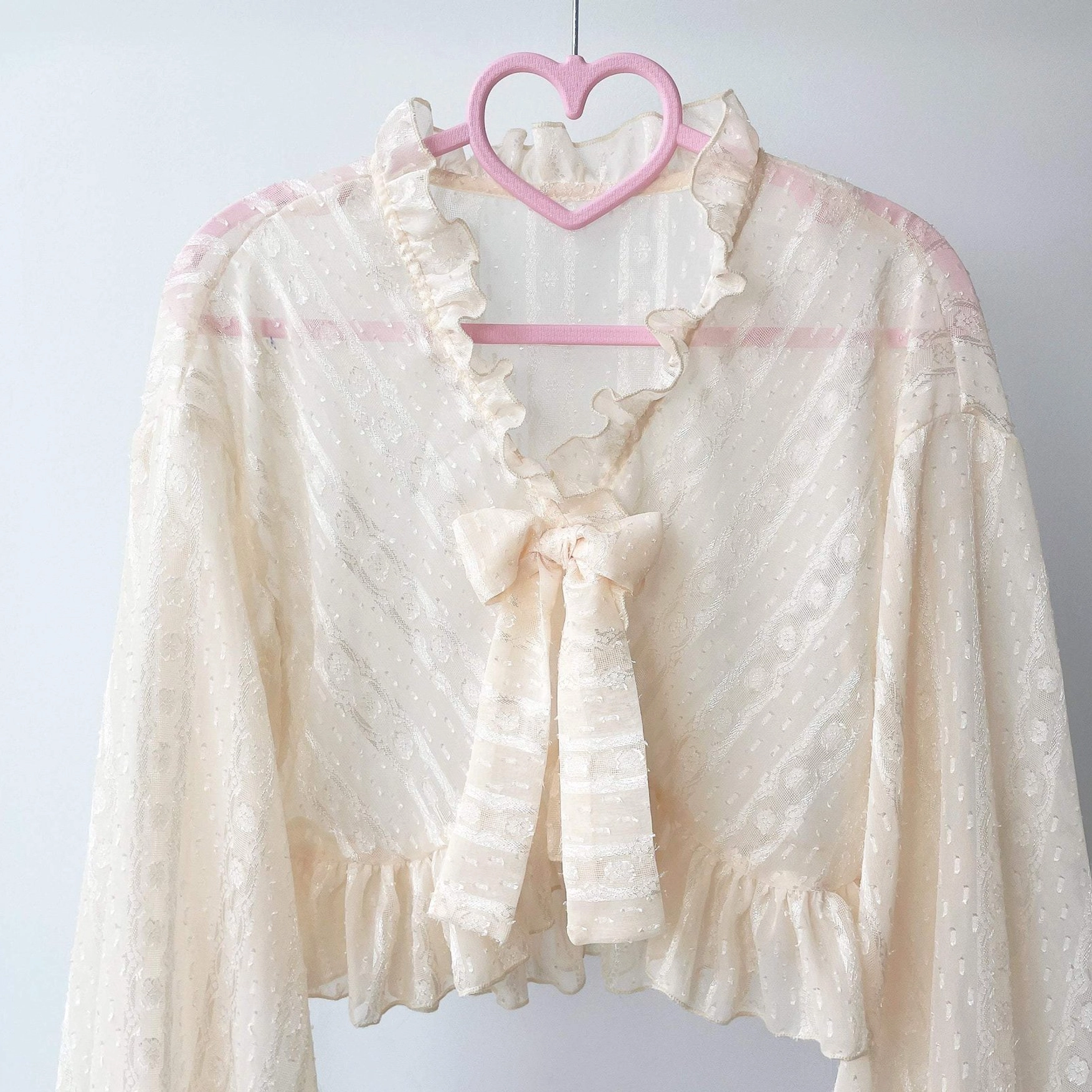 Cropped length silhouette of sheer jacquard chiffon puff sleeve Lolita cardigan showing proportions with tea-length skirt