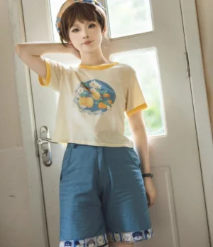Cropped lemon fruit print t-shirt with yellow cuff trims and denim blue shorts full body standing portrait lolita fashion