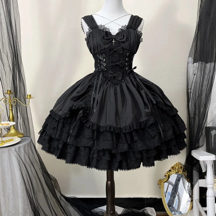 Cross Medal Gothic Lolita JSK jumper dress close-up front view showing crisscross spaghetti straps, lace-up corset waist detail, cross ornament, and layered lace hem design