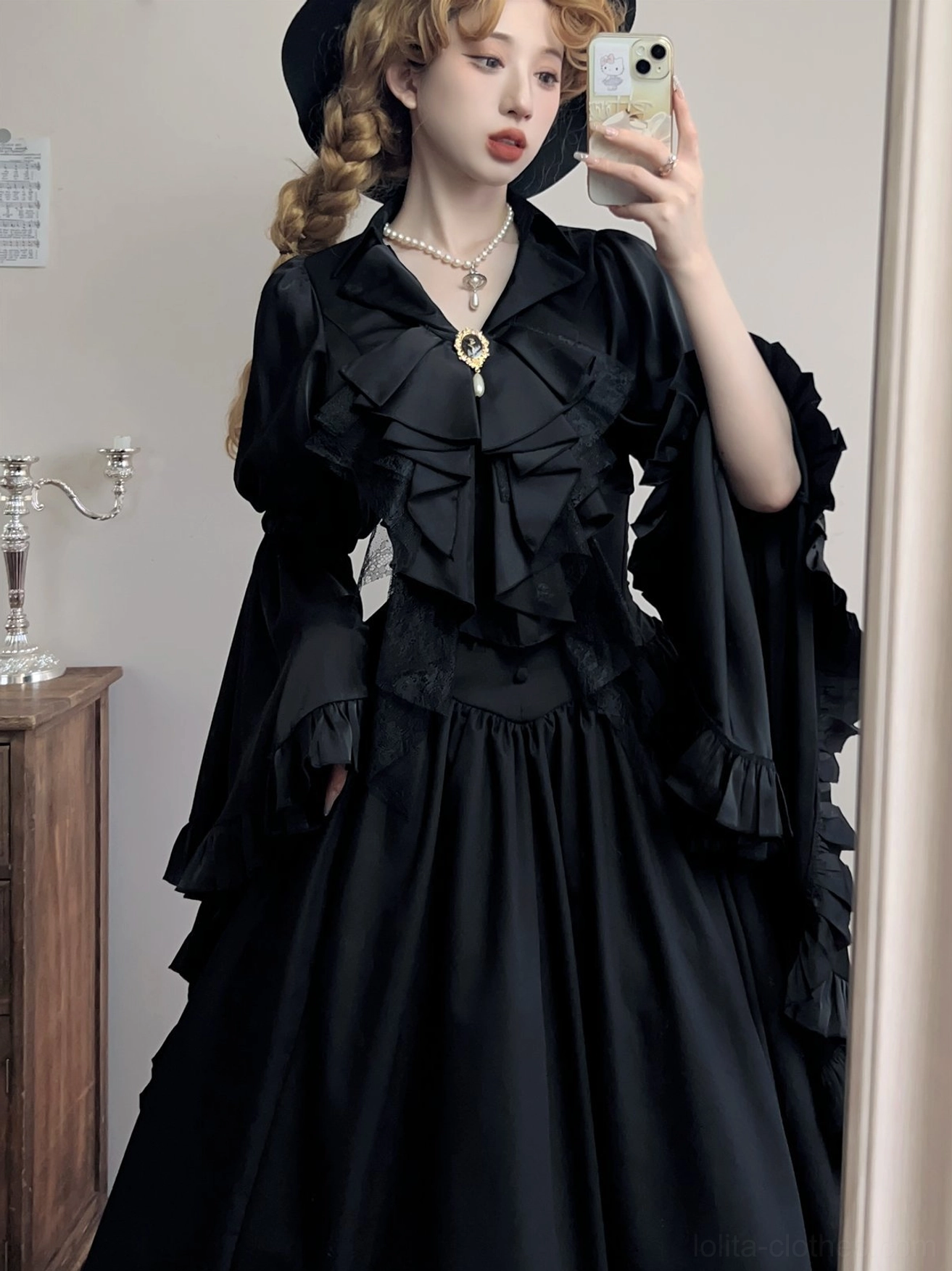 Gothic Lolita coordinate styled with the black Crow's Dinner ruffle jabot, worn with a vintage black dress and Gothic hat in an antique-inspired interior