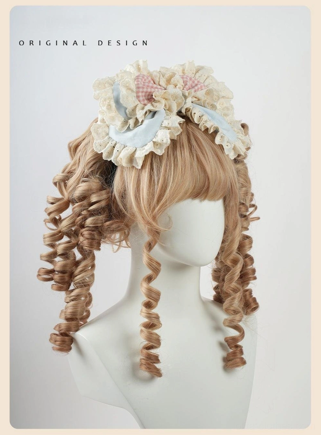 Cupcake-inspired lolita hair accessory with delicate lace ruffles, coordinating pink and blue satin ribbons, fabric cherry embellishment, and adjustable headband base