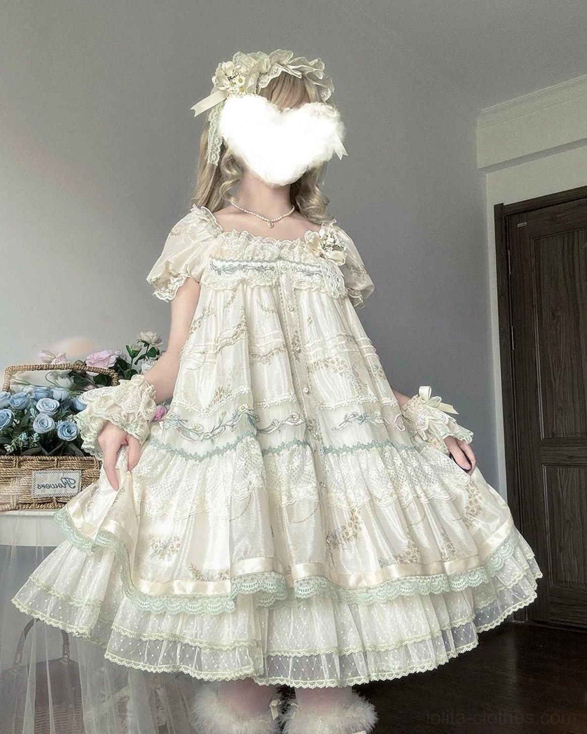 Girl model wearing Daisy Poetry short sleeve classic lolita OP dress with flower hair crown lace wrist cuffs indoor flower decor styling