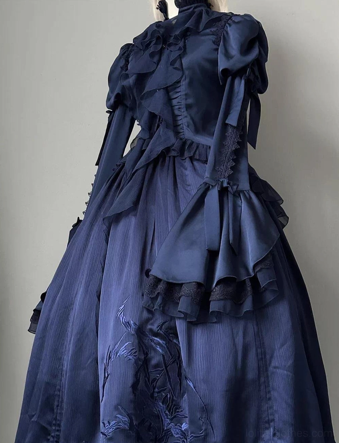 Dark blue gothic lolita blouse detail close-up of stand-up lace-trimmed collar, ruffled panels, and juliet hime sleeve blend construction
