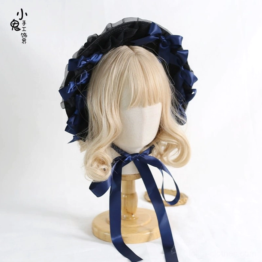 Dark blue lolita bonnet headdress with flowing ribbons elegant styling gothic lolita aesthetic coordination