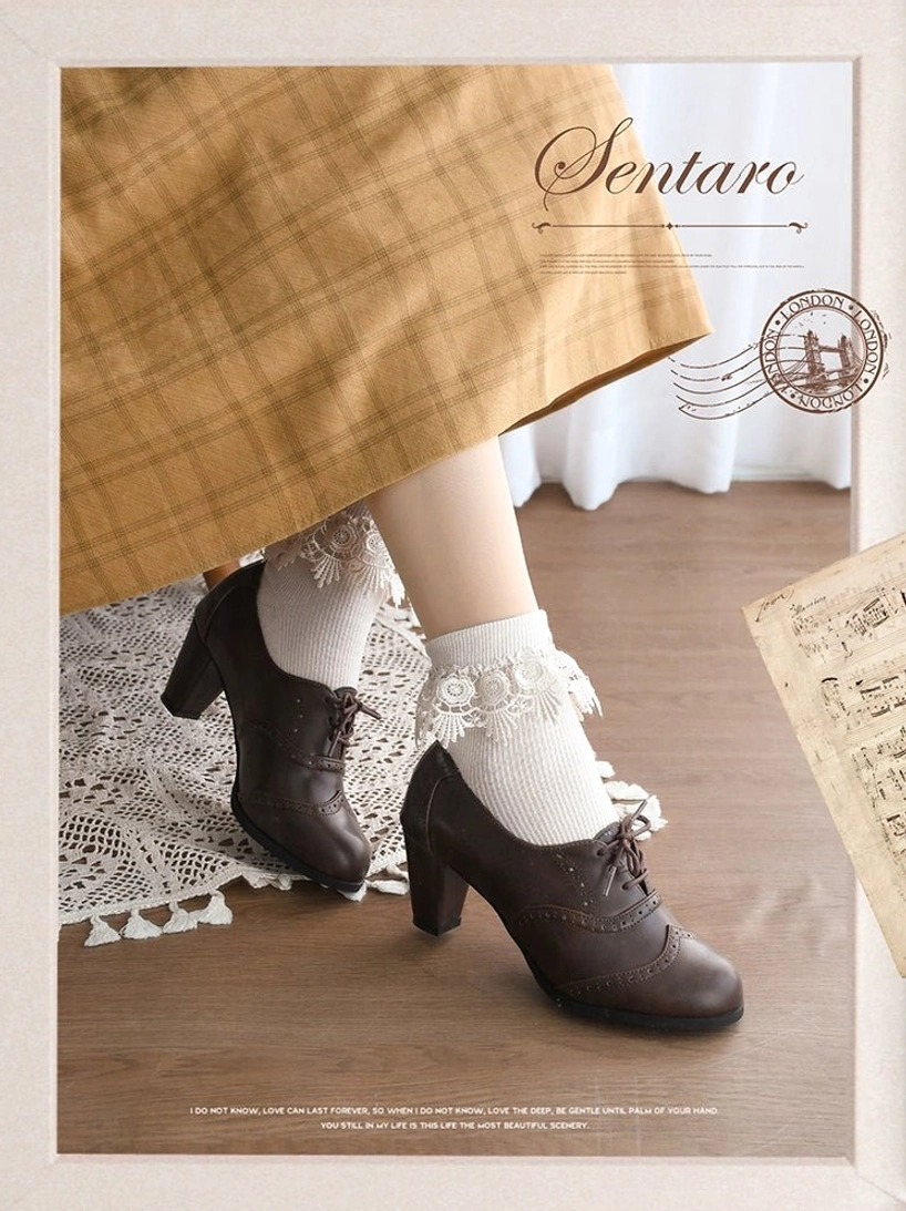 Dark brown handcrafted lolita block heel shoes with brogue perforated details and lace-up closure, styled with yellow plaid vintage skirt and white frilly ankle socks