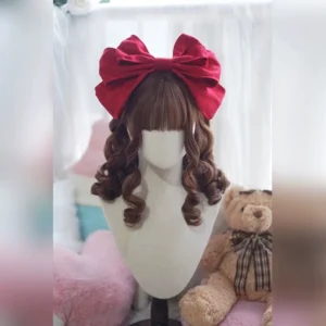Dark brown lolita wig with oversized red satin bow and thick blunt bangs, voluminous ringlet curls, classic lolita coordinate