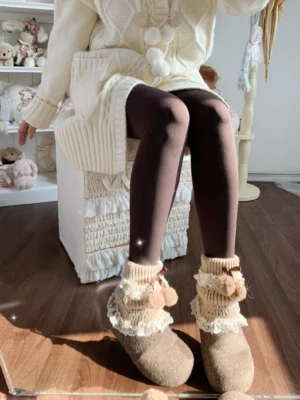 Dark coffee brown winter fleece pantyhose with beige lace leg warmers teddy bear decor and brown loafers cozy indoor wooden setting