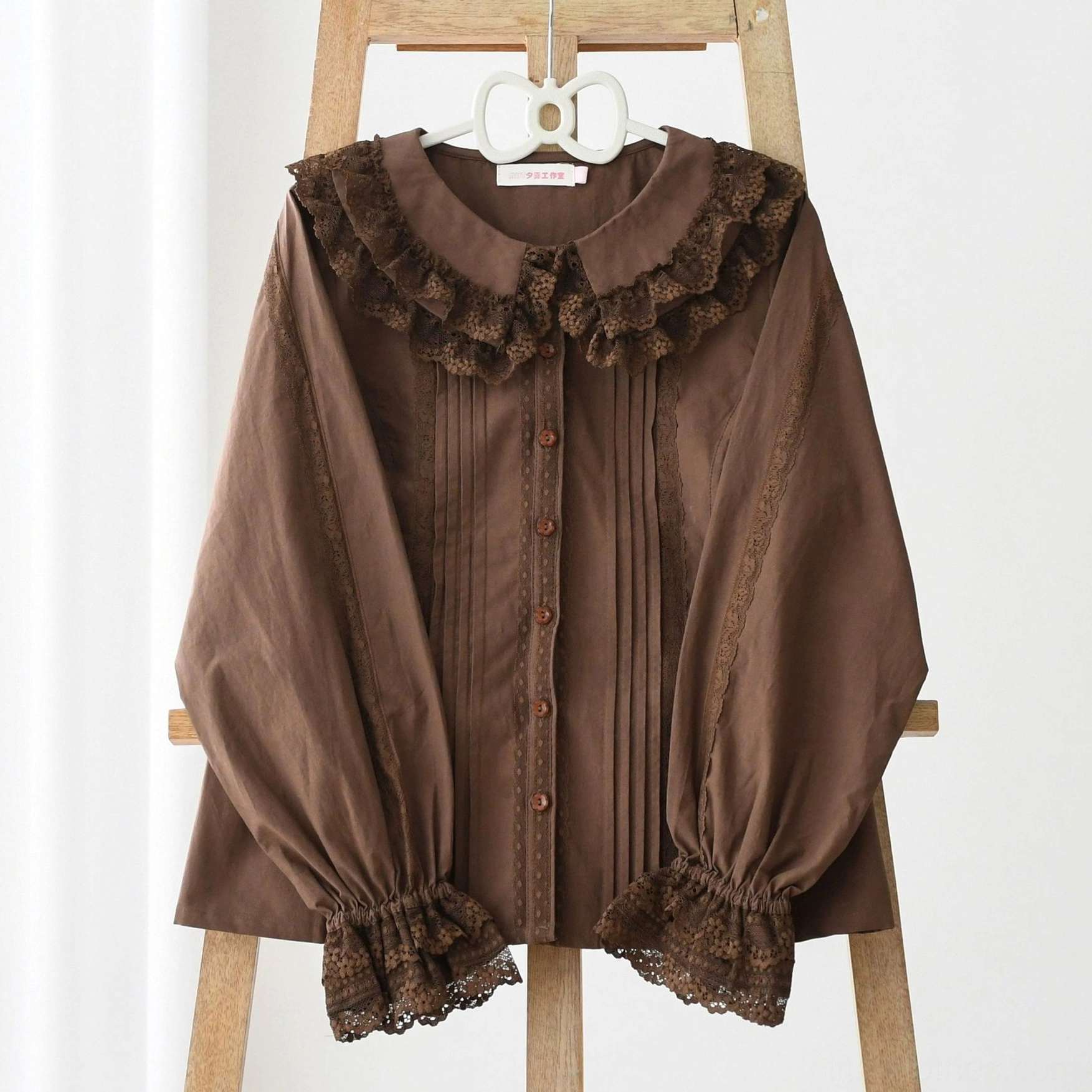 Sweet daily Lolita blouse in dark coffee brown color with long sleeves, lace collar trim, button front closure, and classic feminine silhouette perfect for daily wear and Lolita coordinates