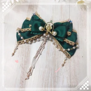 Luxury dark green lolita bow hair brooch with pearl chains and gold tassel metal ornaments, handmade accessory flat lay