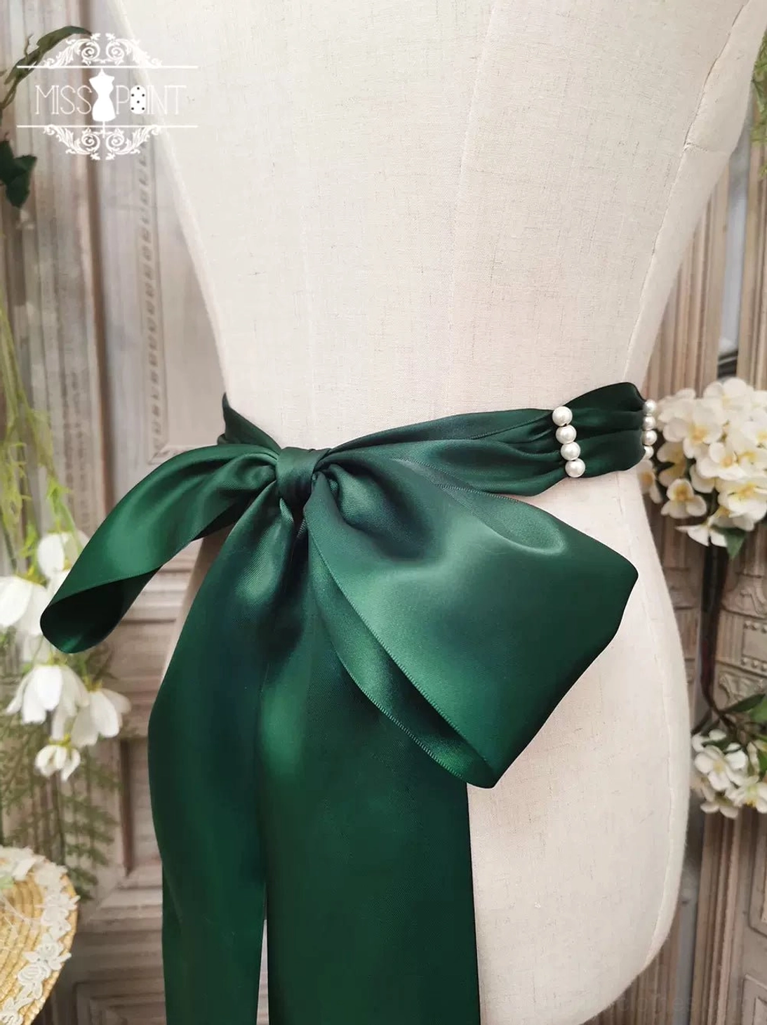 Dark green lolita ribbon beaded belt variant showcasing handmade pearl embellishments and traditional floral weaving details