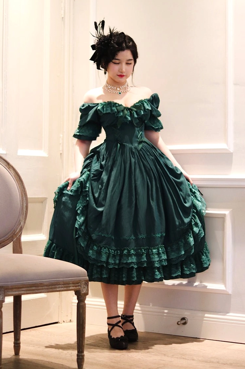 Dark green French Lolita one-piece short dress version showing playful proportions and puff sleeve details