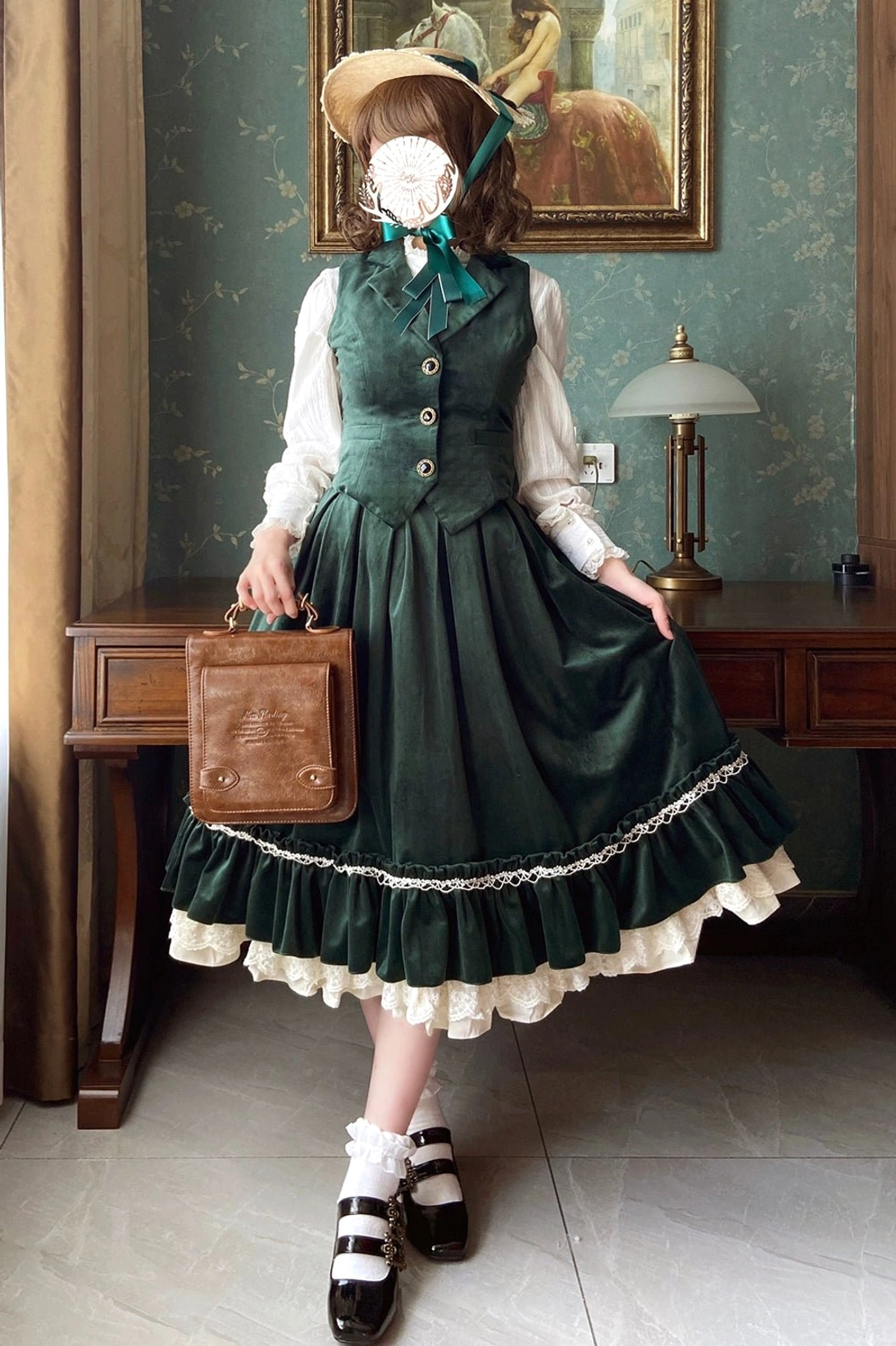 Dark green lolita velvet waistcoat showing muted earth tone colorway and A-line silhouette
