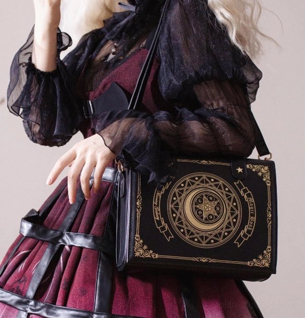 Dark green magic book lolita crossbody bag with structured clamshell design and intricate gold magic circle embroidery patterns