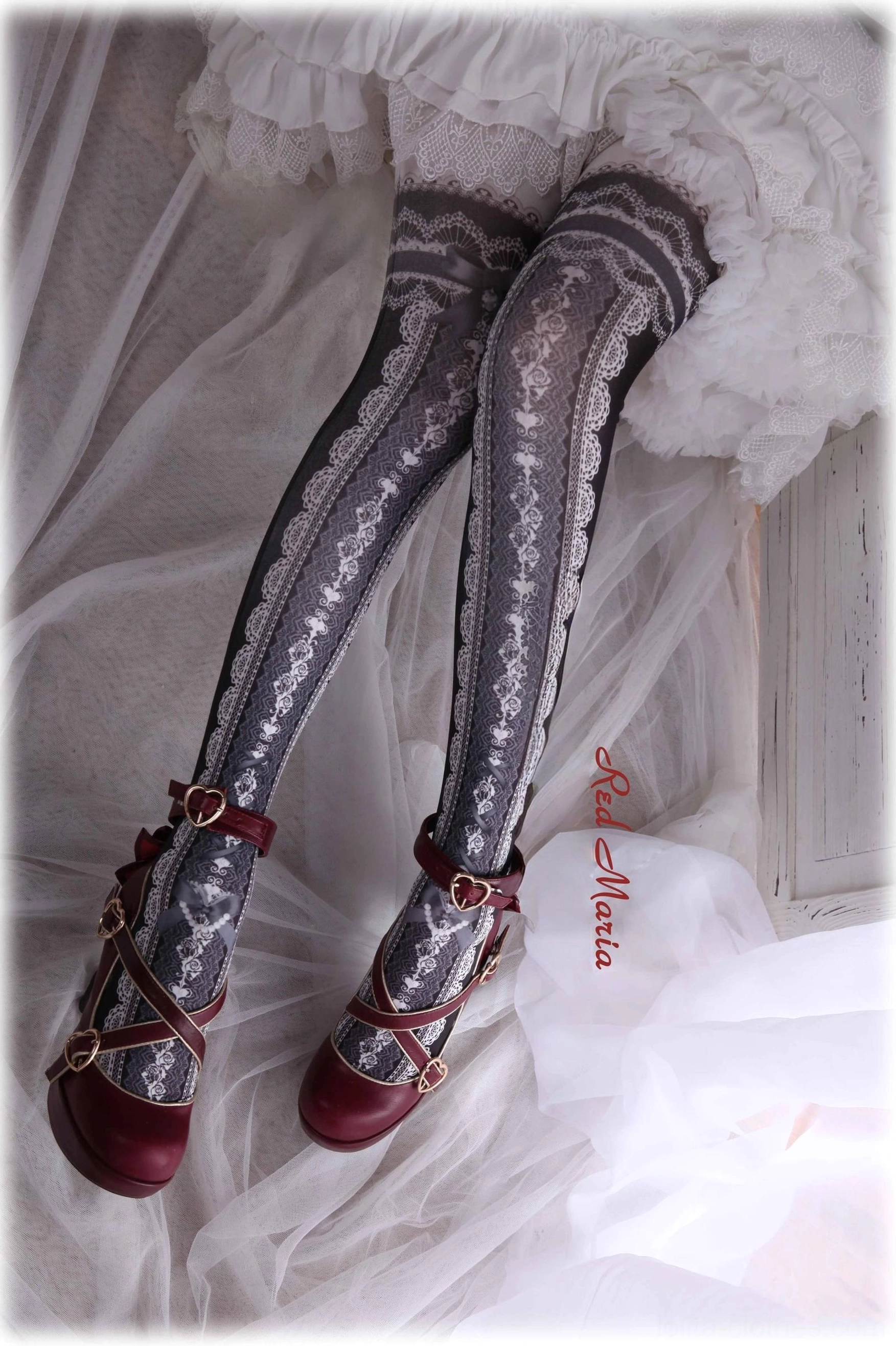 Dark grey lace printed lolita over-the-knee tights with silver floral pattern on model wearing red mary jane shoes