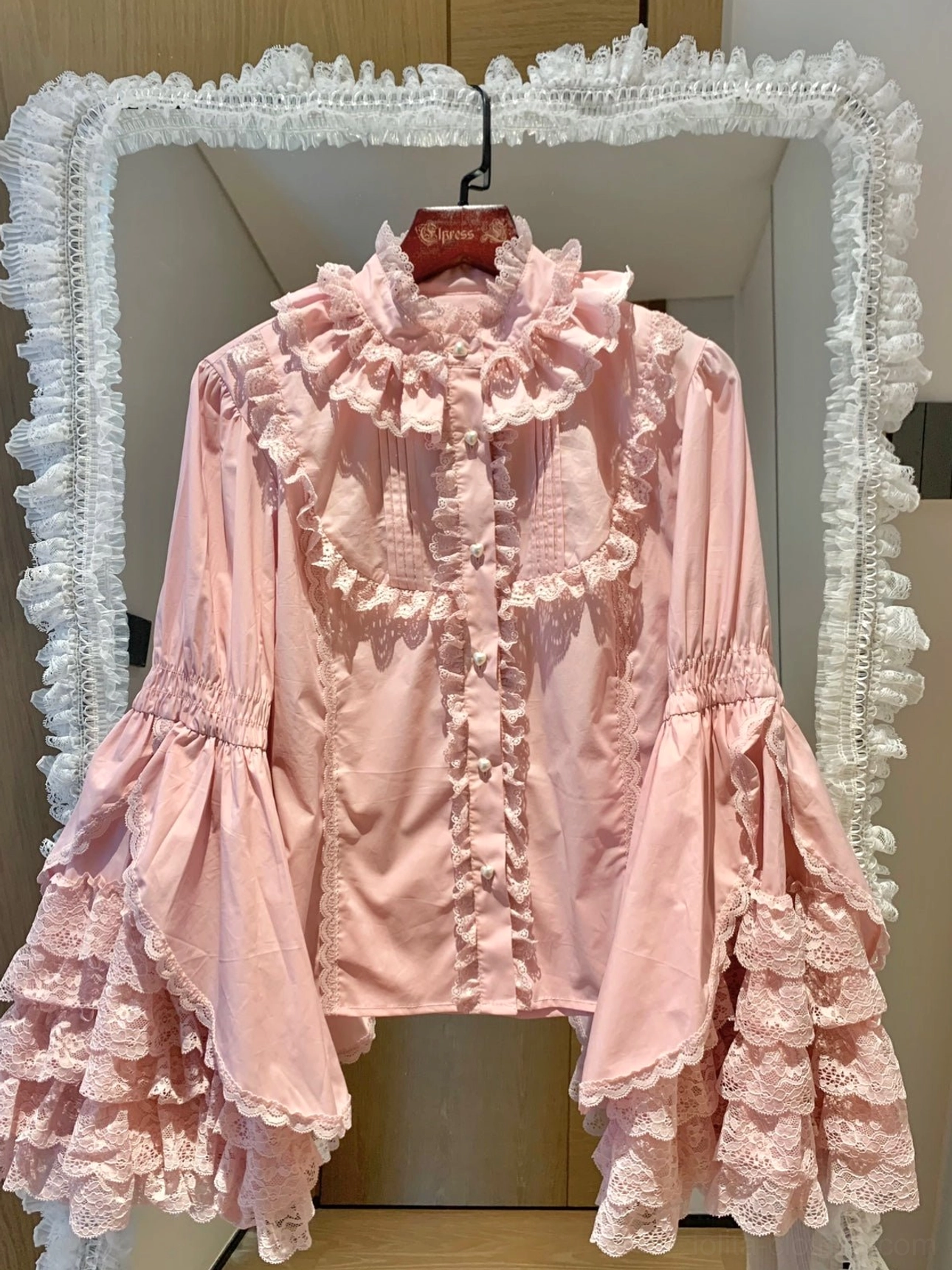 Dark pink Lolita cotton blouse with single-layer bell sleeves and high ruffled collar, front button closure detail