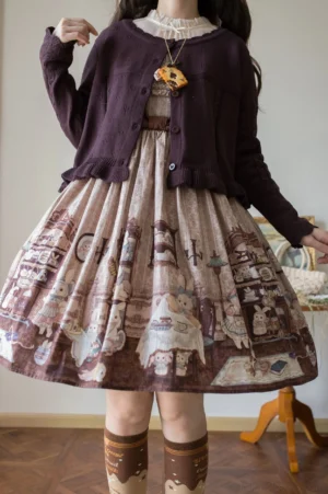 Dark purple lolita cardigan with button front closure paired with vintage cartoon print dress brown socks and bow necklace full lower body model shot