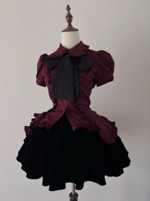 Complete dark red gothic lolita outfit set featuring burgundy ruffled short-sleeve blouse with detachable black bow-tie paired with black tiered mini skirt, full front coordinate display