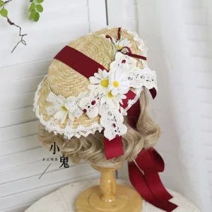 Dark red wine lolita straw tea party hat top view displaying wheat straw weave crocheted lace border and daisy floral ornaments