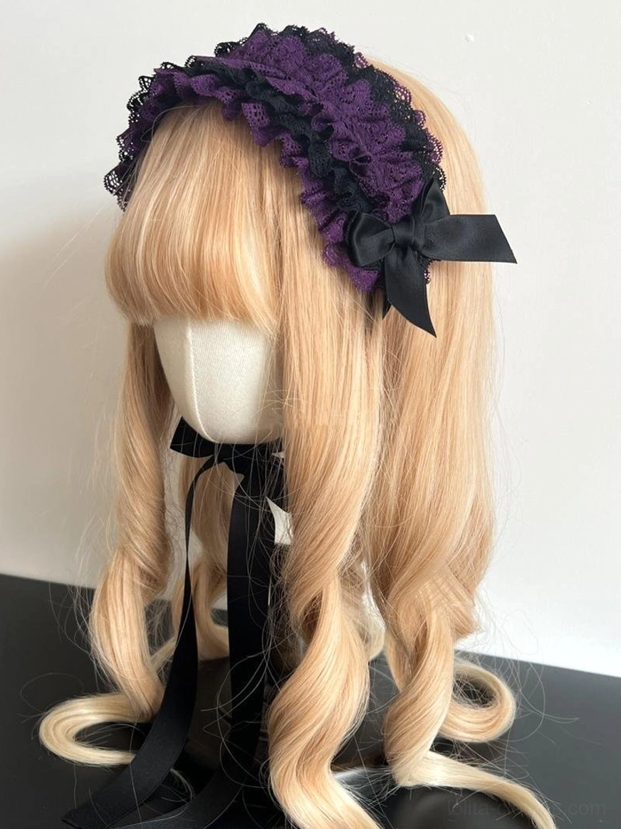 Deep purple lace KC headdress close-up showing hand-stitched ruffled lace trim, precision bow construction, and delicate ribbon detail work