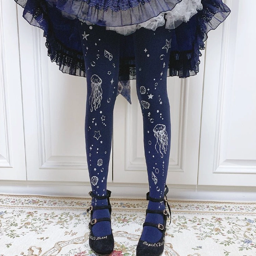 Dark blue Deep Sea Jellyfish 120D velvet Lolita tights with white jellyfish starfish and shell prints, styled with navy frilled Lolita skirt and black buckle loafers, perfect for gothic and romantic Lolita fashion coordinates