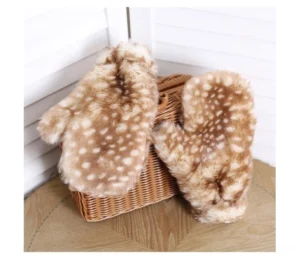 Fluffy deer spot faux fur Christmas Lolita mittens displayed beside a woven basket