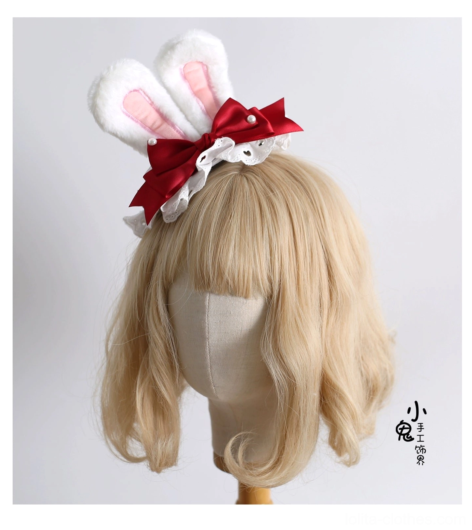 Delicate sweet lolita bunny ear hair accessory with pink inner fur ears, red satin bow, lace trim, and compact styling shown on blonde wig side view