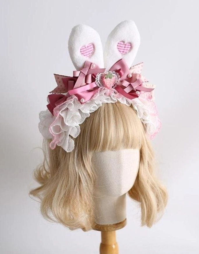 Deluxe lolita rabbit ear headdress front three-quarter view wooden display stand blonde mannequin plush bunny ears heart patterns strawberry brooch ruffled lace satin bows
