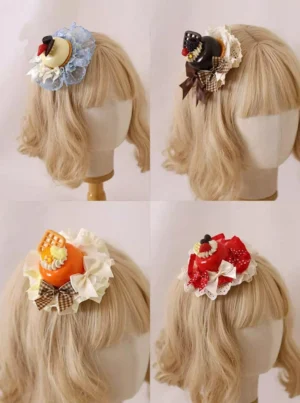 Four styles of dessert Lolita headdress hairpins shown on blonde mannequin wigs displaying side and back views of blue brown orange and red themed cake-inspired designs
