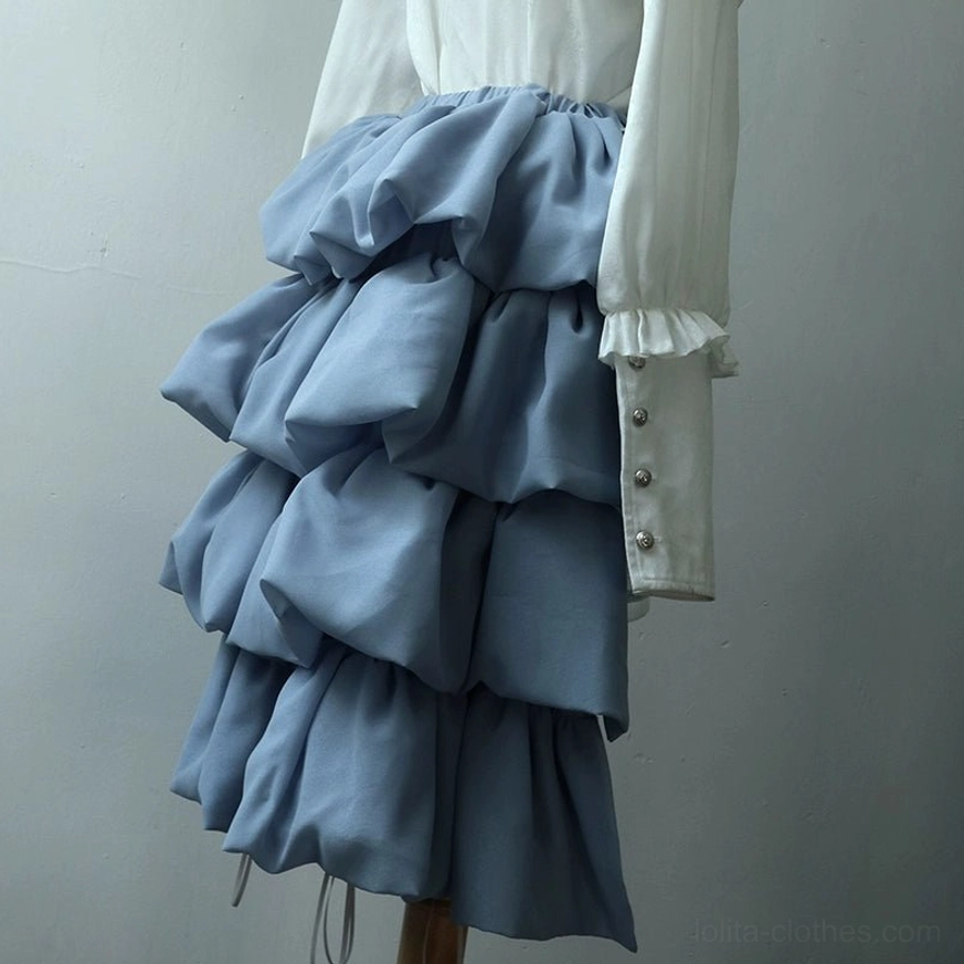 Detachable ruffled bustle skirt accessory side close-up view multi-layered ash blue satin ruffled decoration