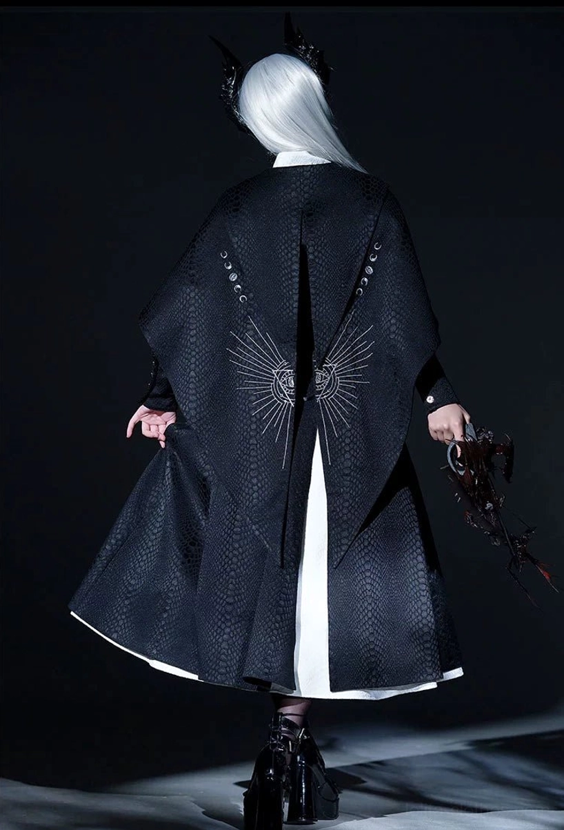 Black Gothic Lolita coat back view with silver radial embroidery pattern and white inner lining hem