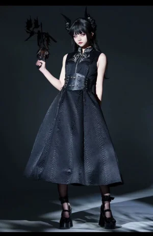 Black Gothic Lolita jumper skirt with silver embroidered collar worn by model with horn headpiece and black stockings