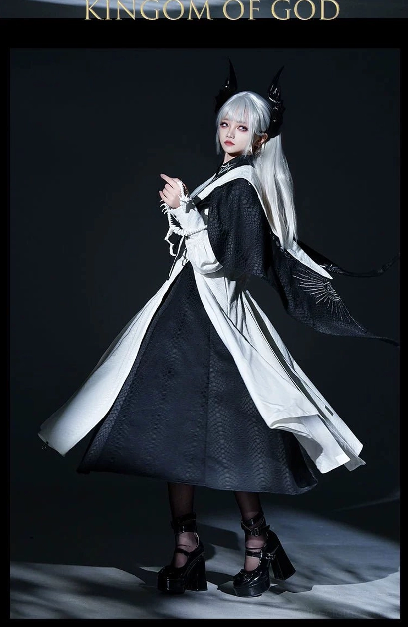 Black and white Gothic Lolita outerwear with black shoulders and white midi skirt and silver shoulder embroidery