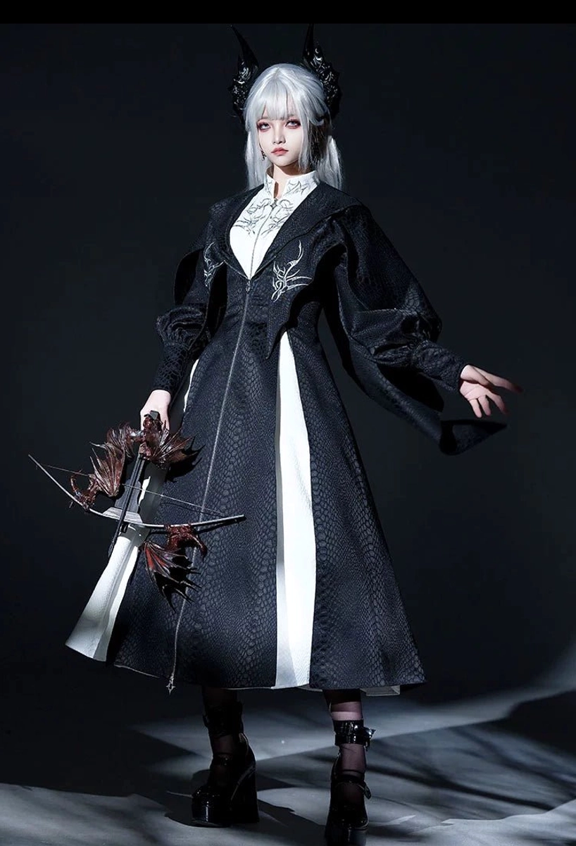 Black and white two-tone Gothic Lolita long coat with vertical white front panel and silver chest embroidery