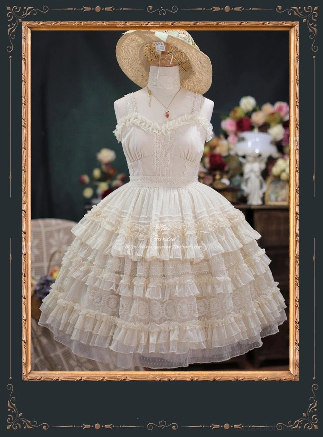 Cream ivory lolita JSK dress featuring sweetheart lace neckline, multi-tiered ruffled tulle skirt with embroidered fitted bodice, mannequin wears straw hat and pendant necklace