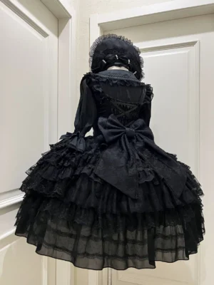 Black Gothic Lolita JSK dress suit with oversized back bow and lace-up corset back design shown from behind on mannequin