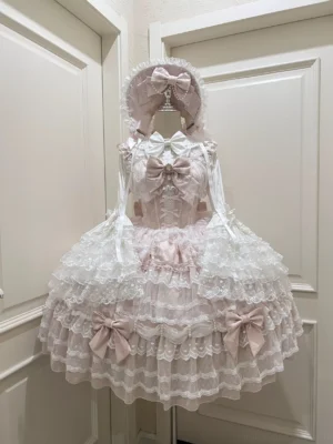 Dream Prelude pink princess Lolita JSK dress suit with tiered lace ruffles and pearl decorations displayed on dress mannequin front view