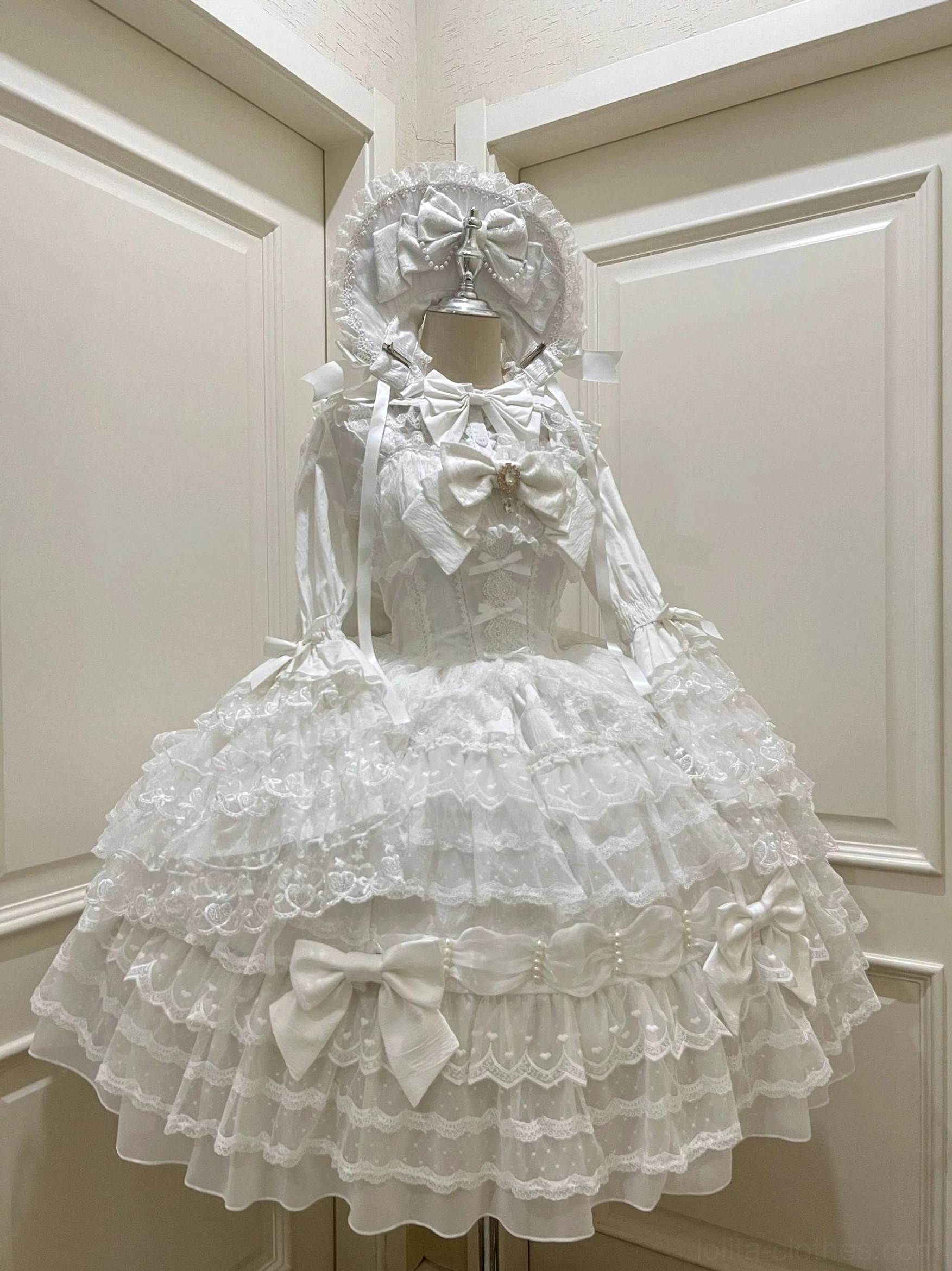 Pure white Lolita JSK dress suit with delicate lace trims tiered ruffle skirt small satin bows and bow headwear side view